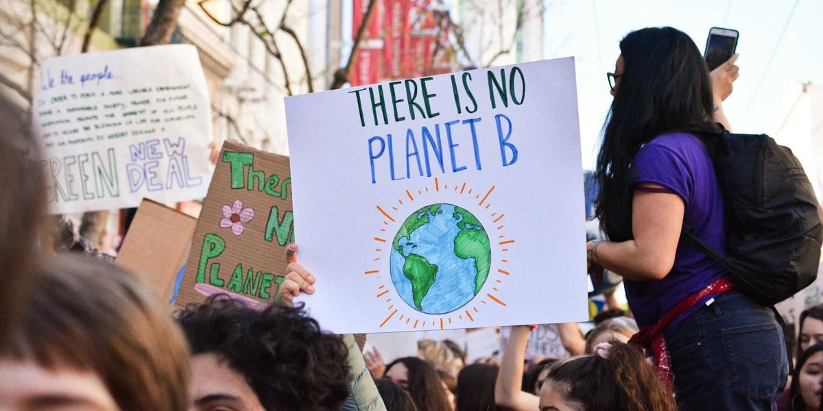 Crowd of young people marching for the planet