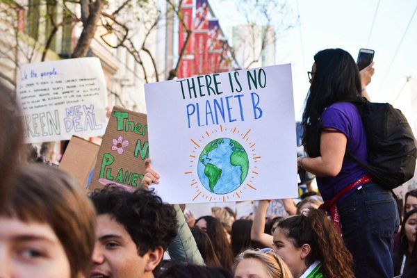 Crowd of young people marching for the planet