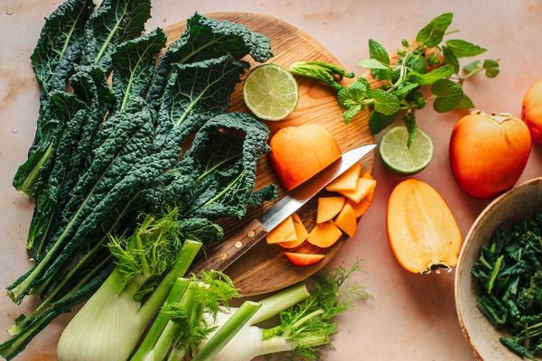 Cutting board adorned with fresh vegetables and fruit