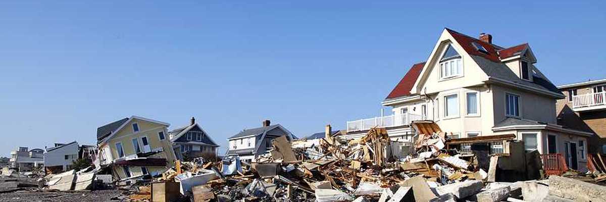 Damaged houses along a beach