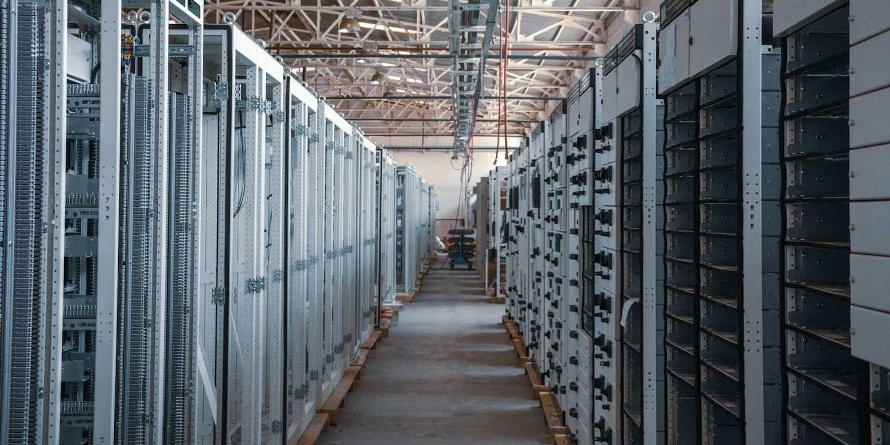 Data Center corridor lined with racks and racks of electronics