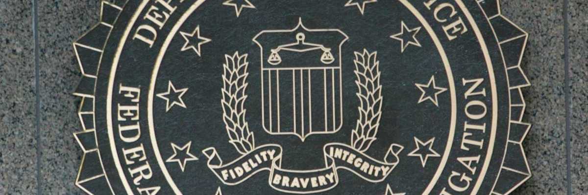 Department of Justice/FBI sign with DOJ seal "Fidelity, Bravery, Integrity"