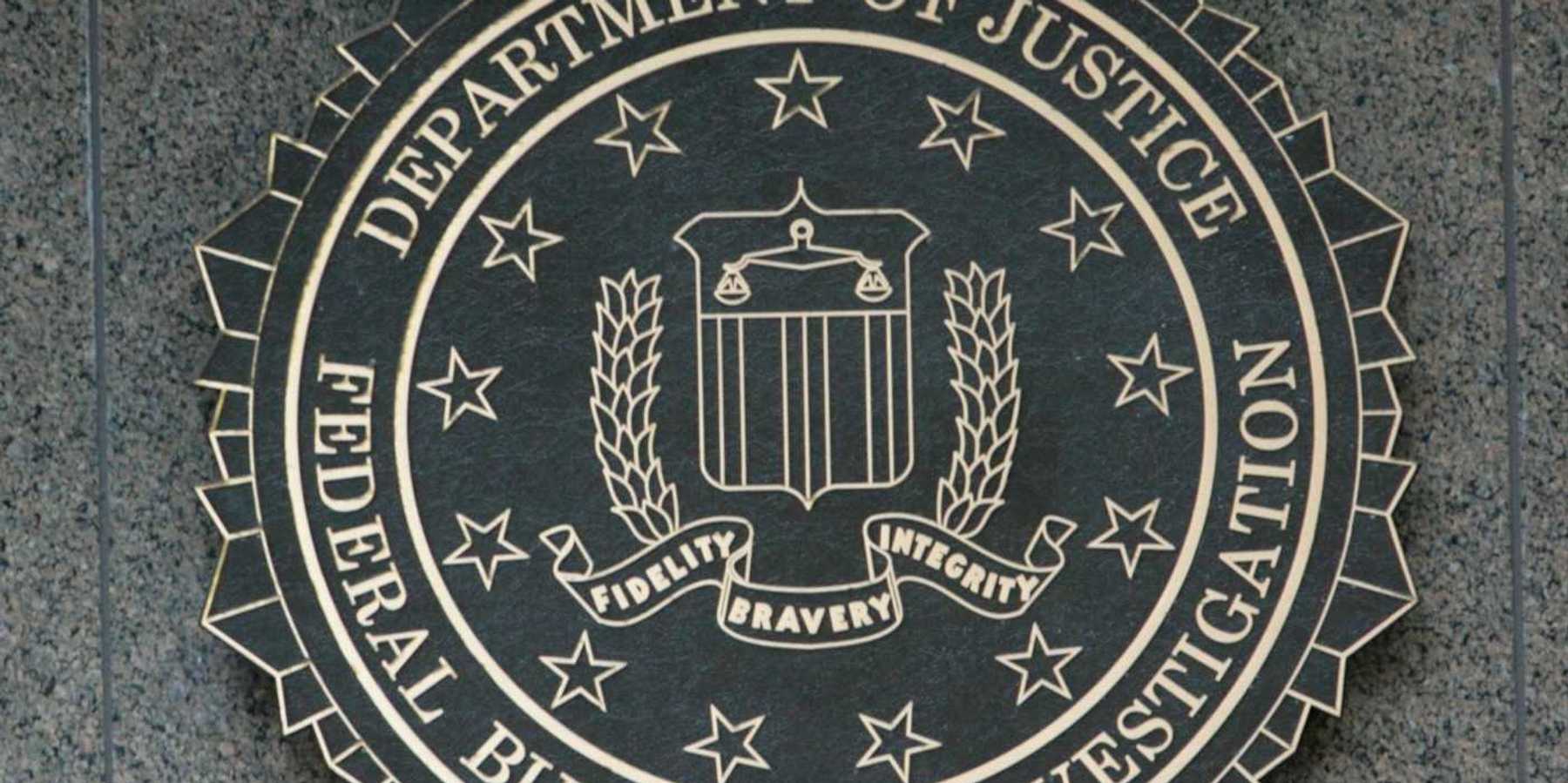 Department of Justice/FBI sign with DOJ seal "Fidelity, Bravery, Integrity"