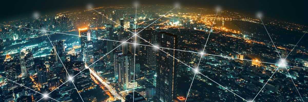 Depiction of network and connection technology on a night city background at business center bangkok thailand.
