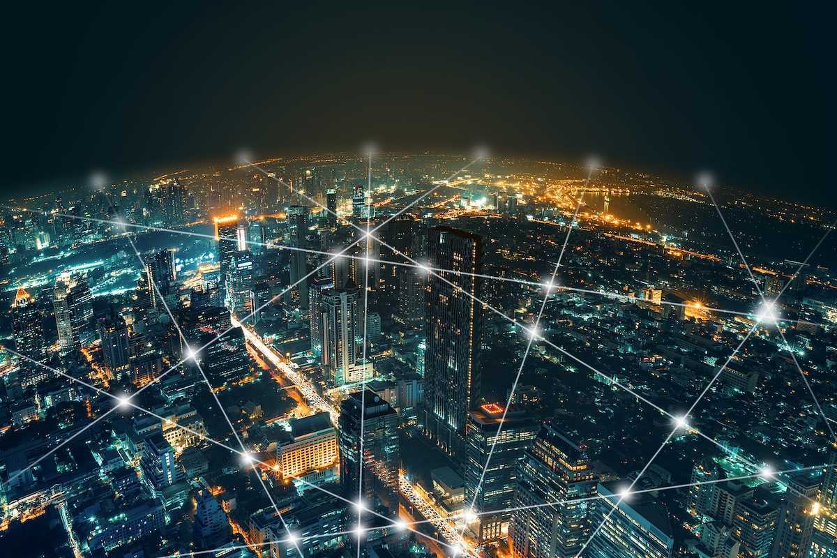 Depiction of network and connection technology on a night city background at business center bangkok thailand.