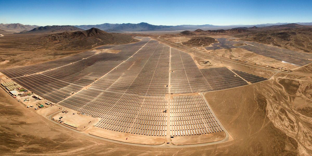 Desert field with solar panels.
