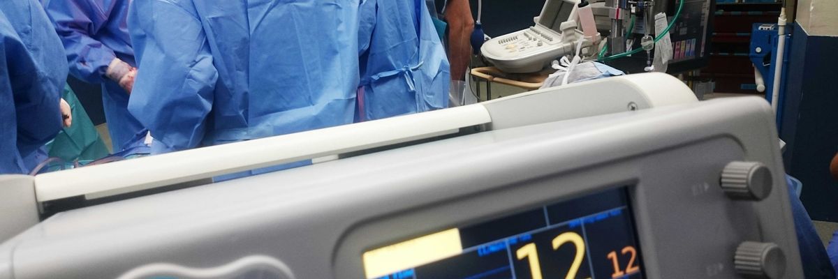 doctors doing surgery inside emergency room.