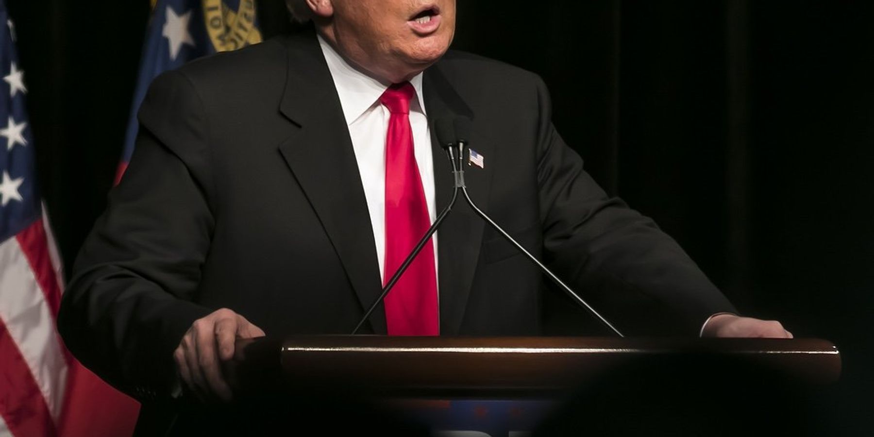 Donald Trump speaking at lectern