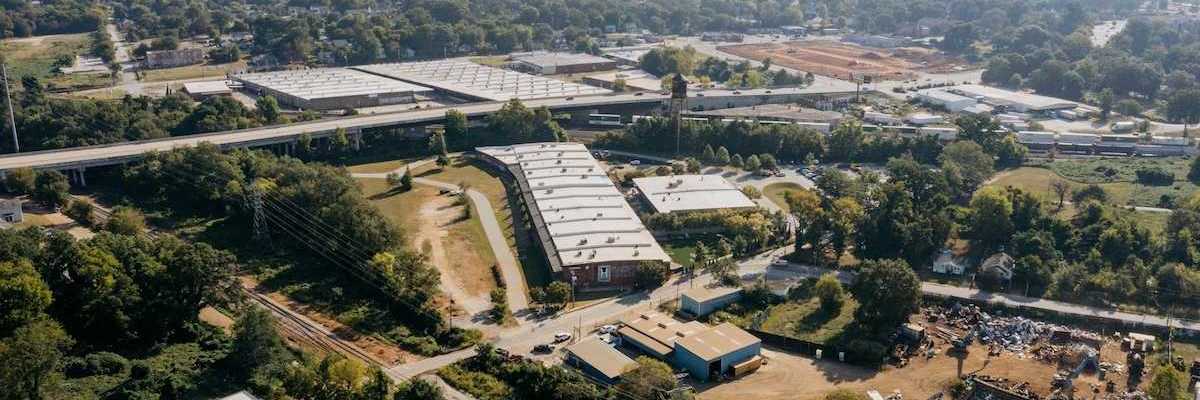 Drone shot of industrial buildings in a rural/urban area