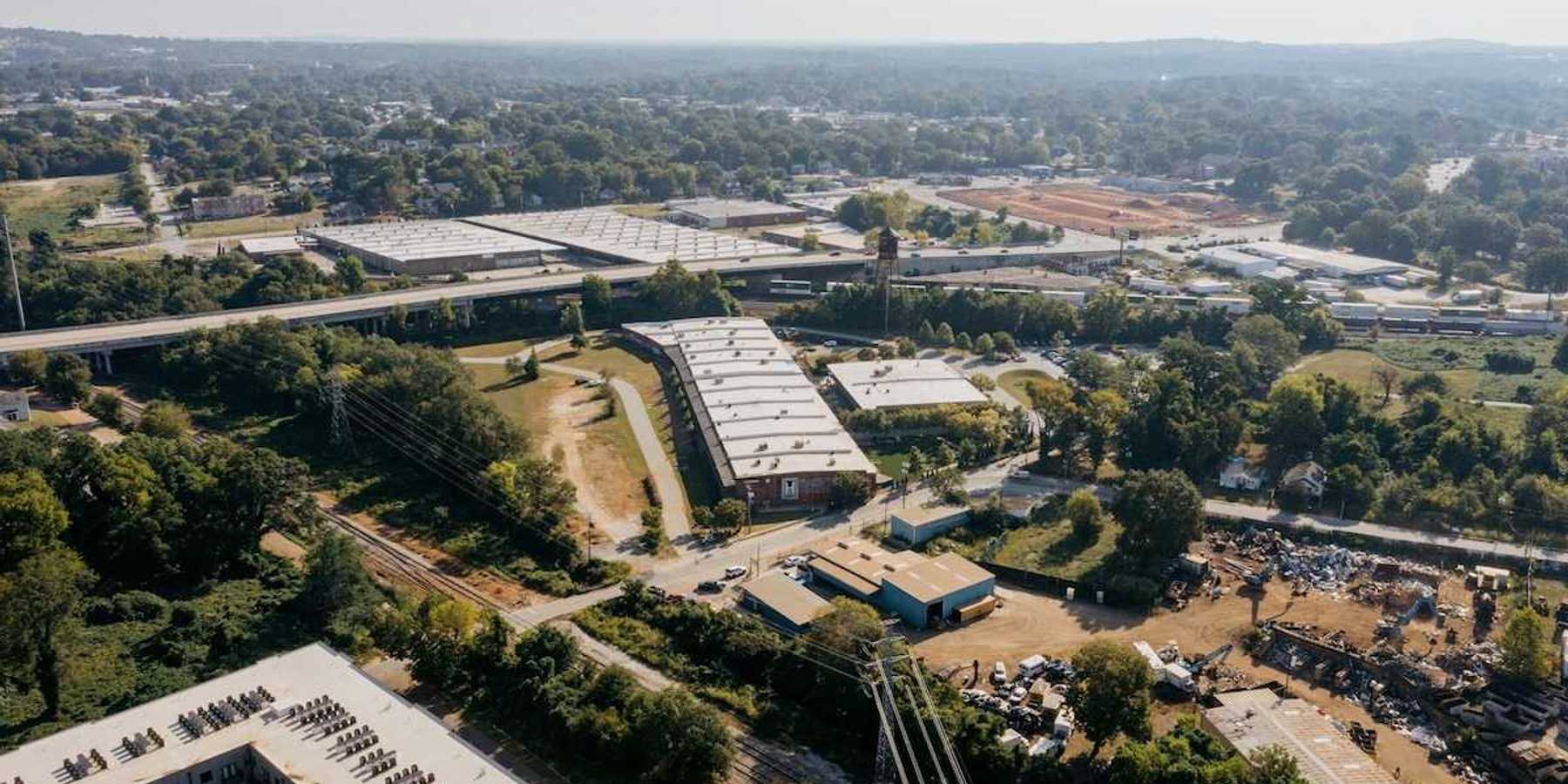 Drone shot of industrial buildings in a rural/urban area