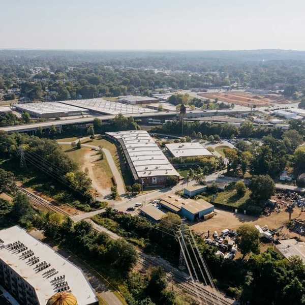 Drone shot of industrial buildings in a rural/urban area