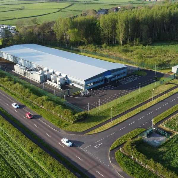 Drones-eye-view of a data center in rural countryside.
