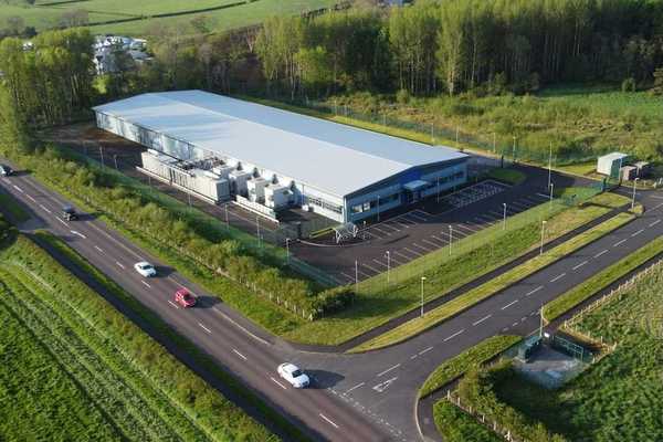 Drones-eye view of a data center sited in rural farm country