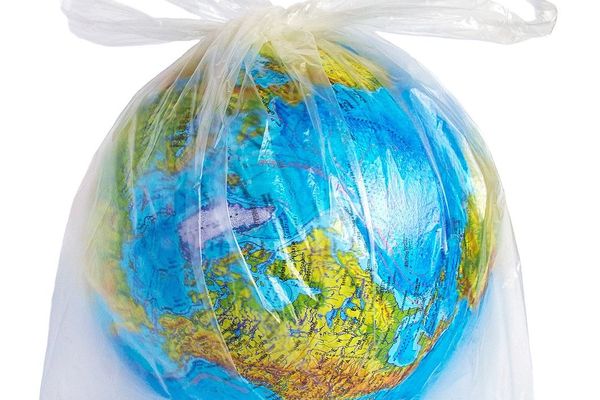 Earth depicted as a globe encased in a plastic bag.
