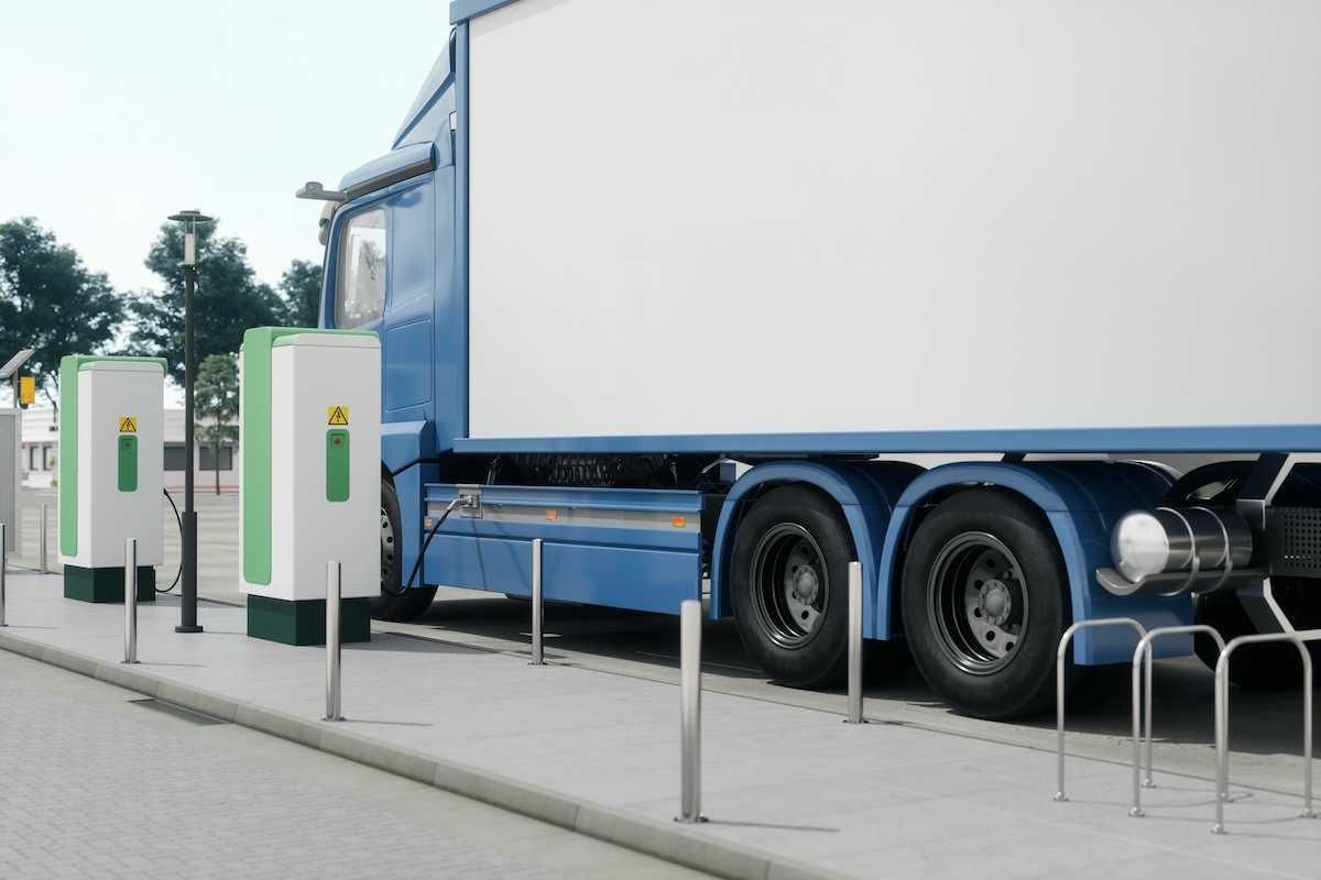 Electric semi-truck filling up at a charging station