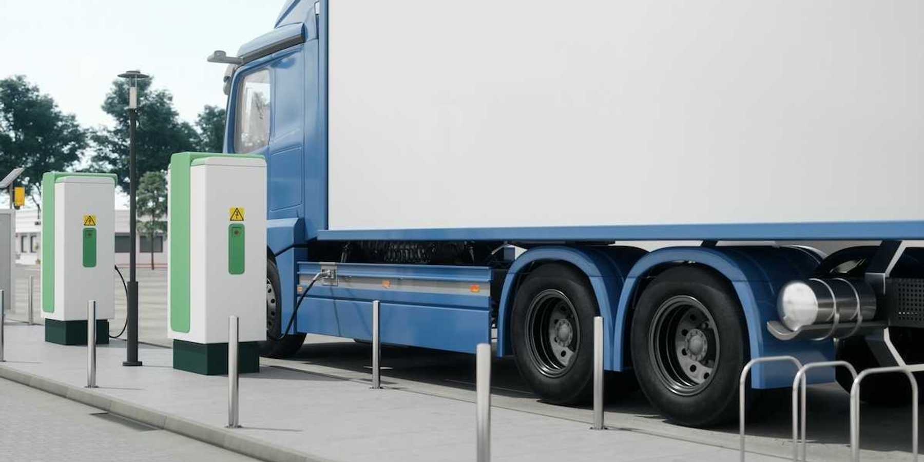 Electric semi-truck filling up at a charging station