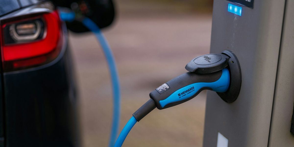 electric vehicle EV charging at a charging station.