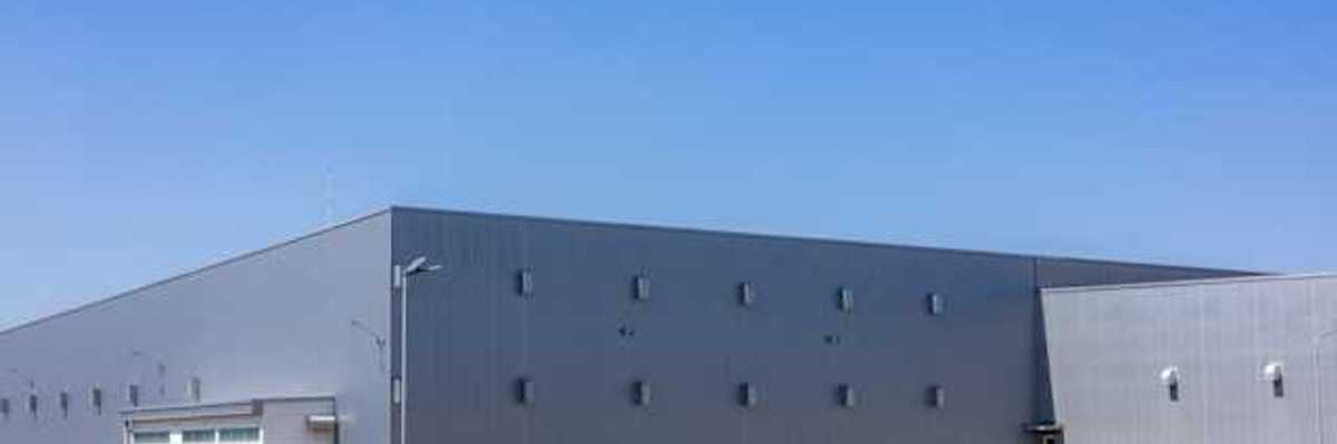 Exterior of a gray warehouse-type building