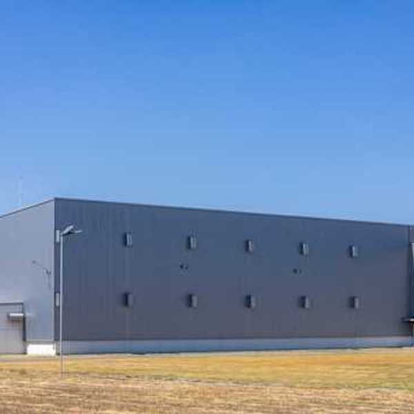 Exterior of a gray warehouse-type building