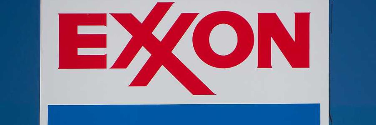 EXXON sign against blue-sky background