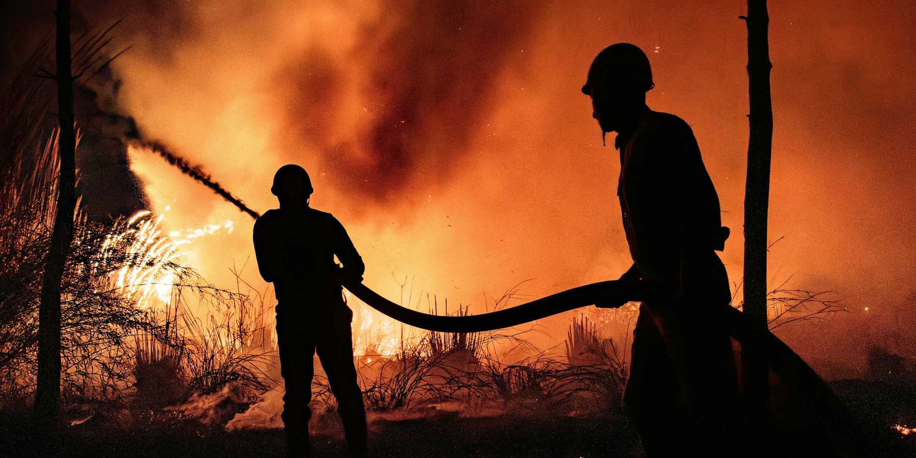 Firefighters fight a blaze