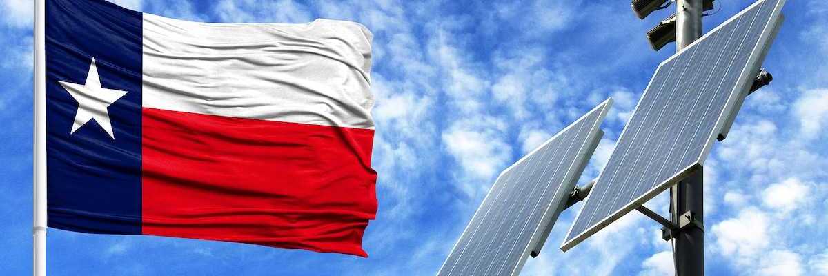 Flag of Texas adjacent to solar panels
