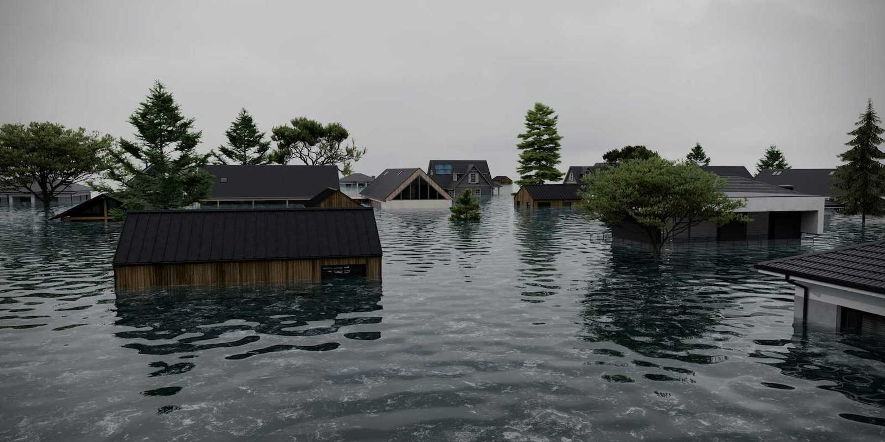 Flooded coastal neighborhood. Partially submerged homes and structures.