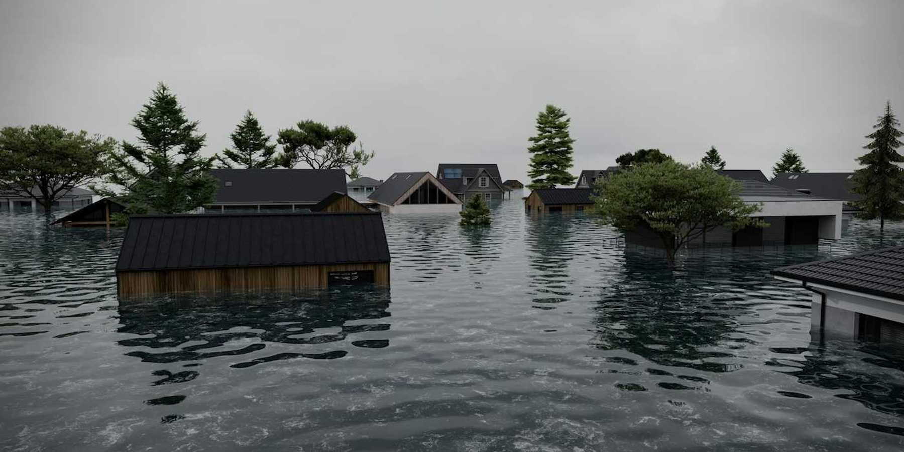 Flooded neighborhood. Multiple homes with floodwaters halfway up the first story.