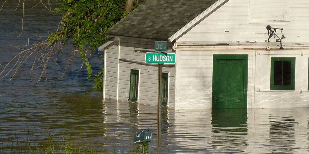 Floodwaters rising near a home