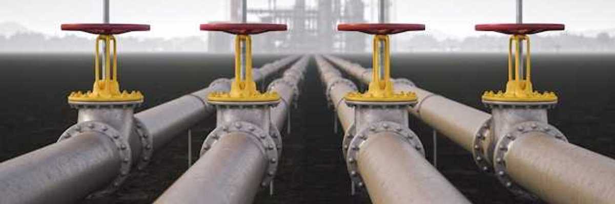 Four gas pipelines stretching toward a gas facility