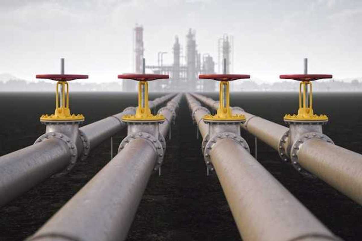 Four gas pipelines stretching toward a gas facility