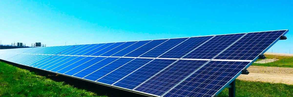 Free standing solar panels on green grass