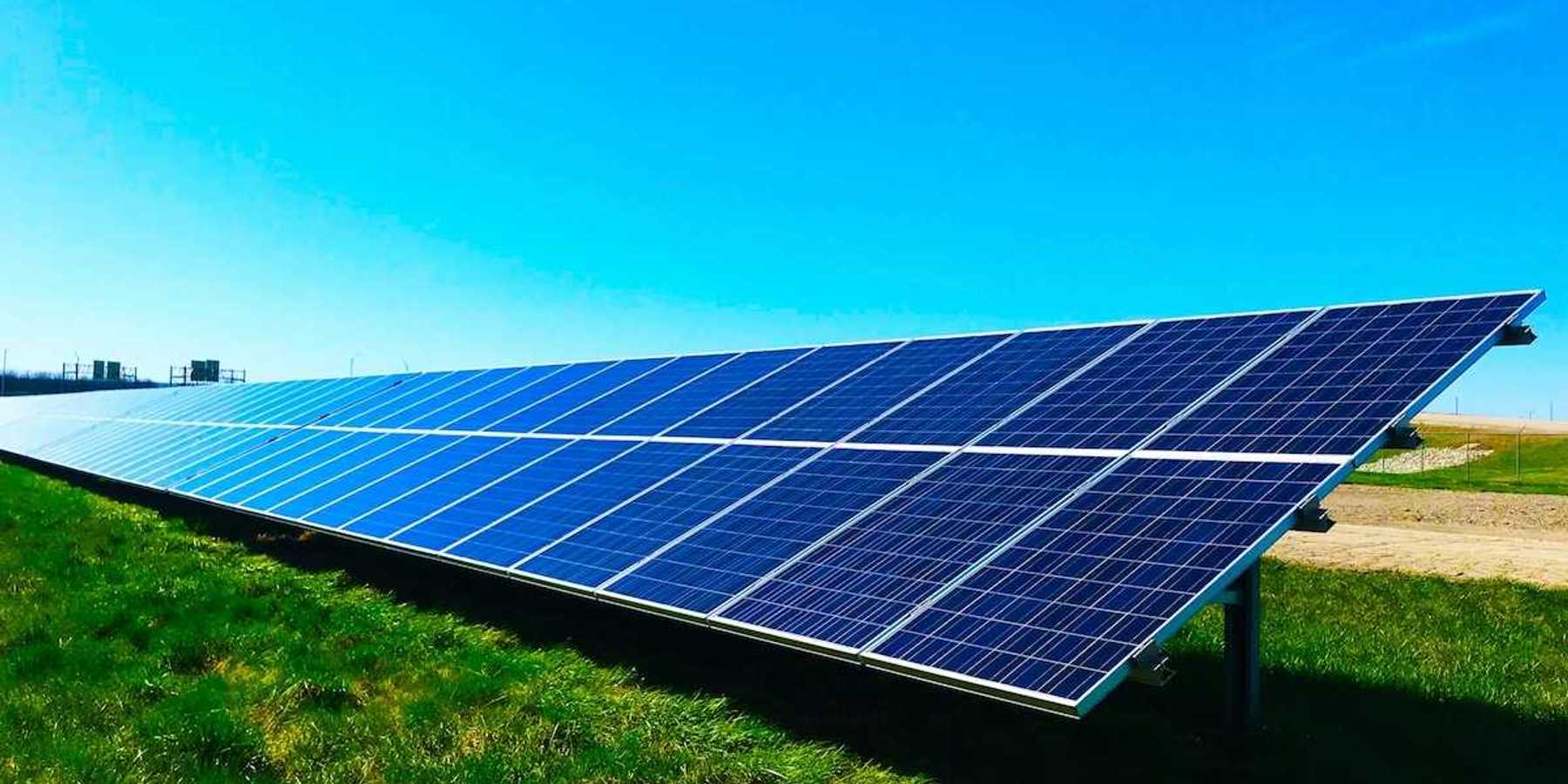 Free standing solar panels on green grass