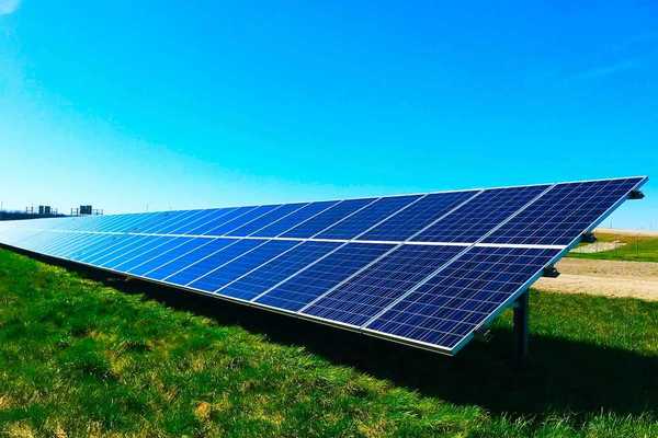 Free standing solar panels on green grass