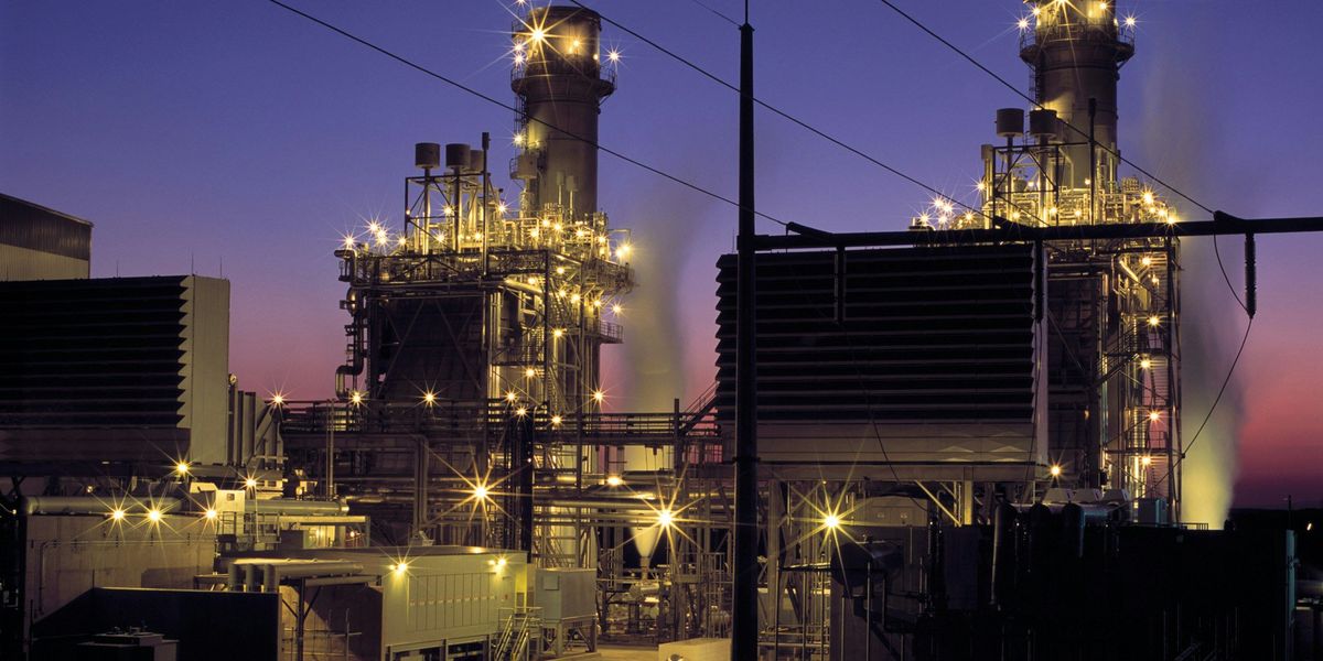 Gas refinery lit up at night