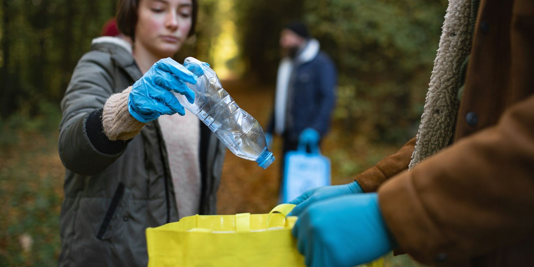 girl recycling plastic bottle