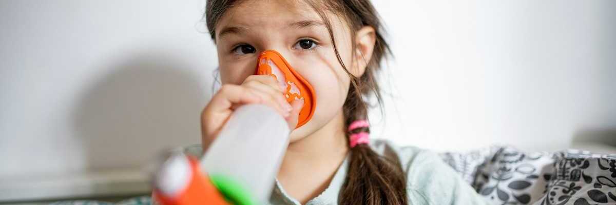 Girl using an inhaler