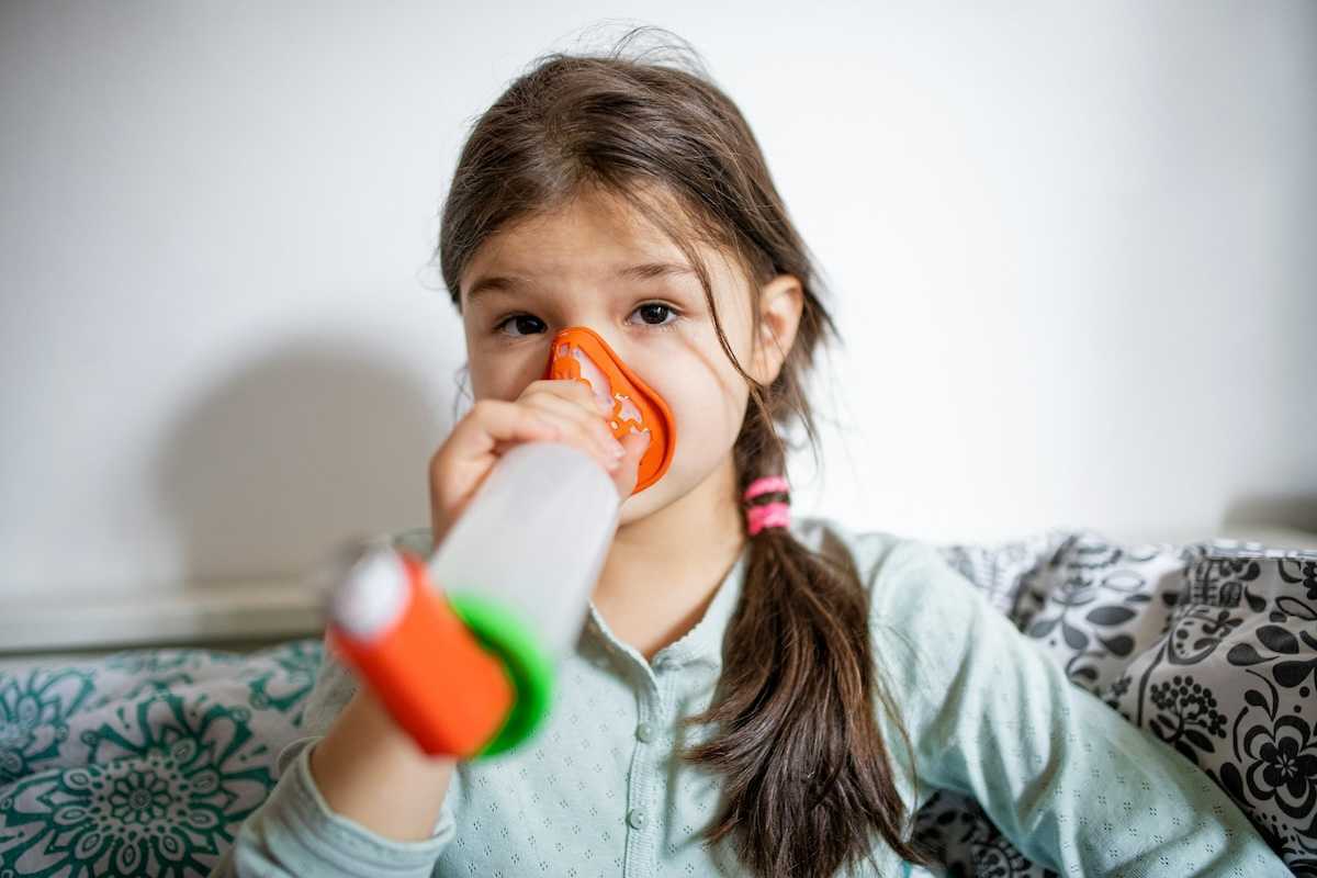 Girl using an inhaler