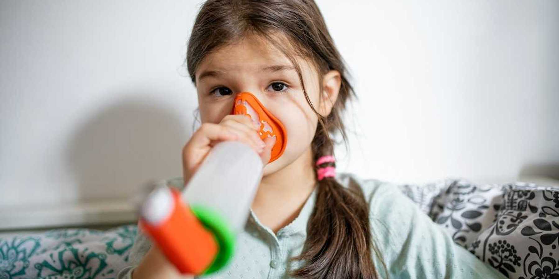 Girl using an inhaler