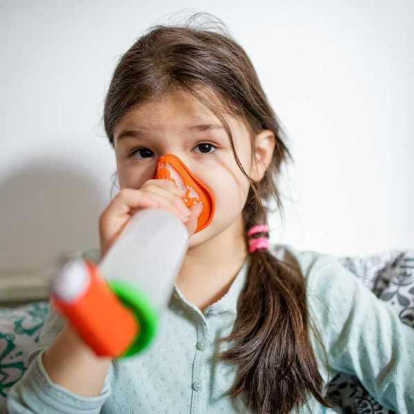 Girl using an inhaler