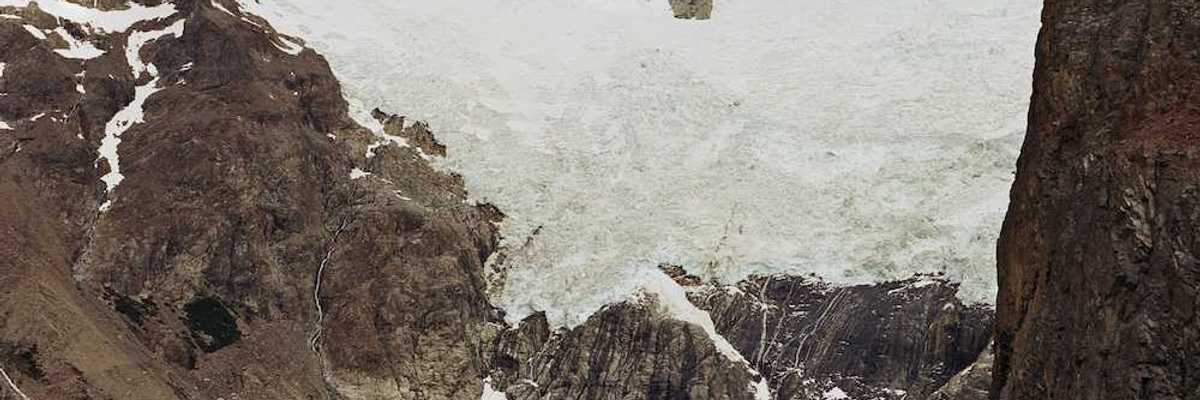 Glaciers hanging over an alpine lake formed by glacial meltwater