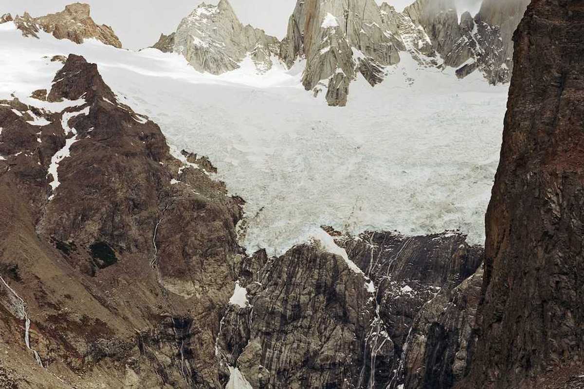 Glaciers hanging over an alpine lake formed by glacial meltwater
