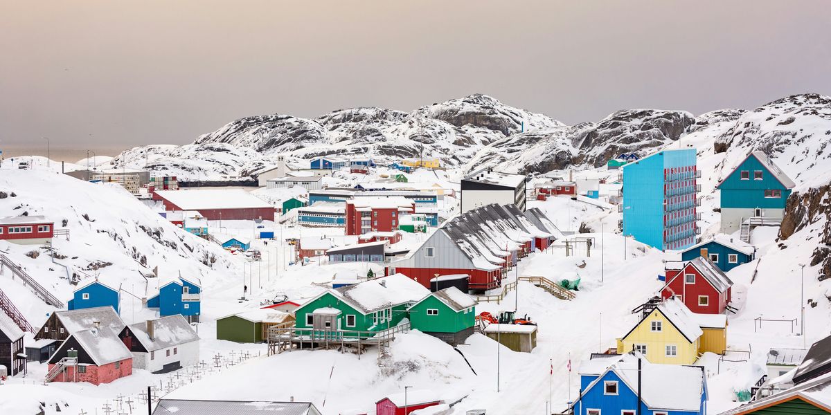 Greenland town on hill covered with snow