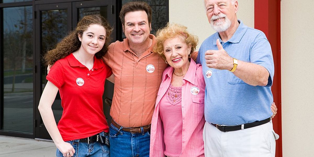 Group of four people who voted posing for a picture