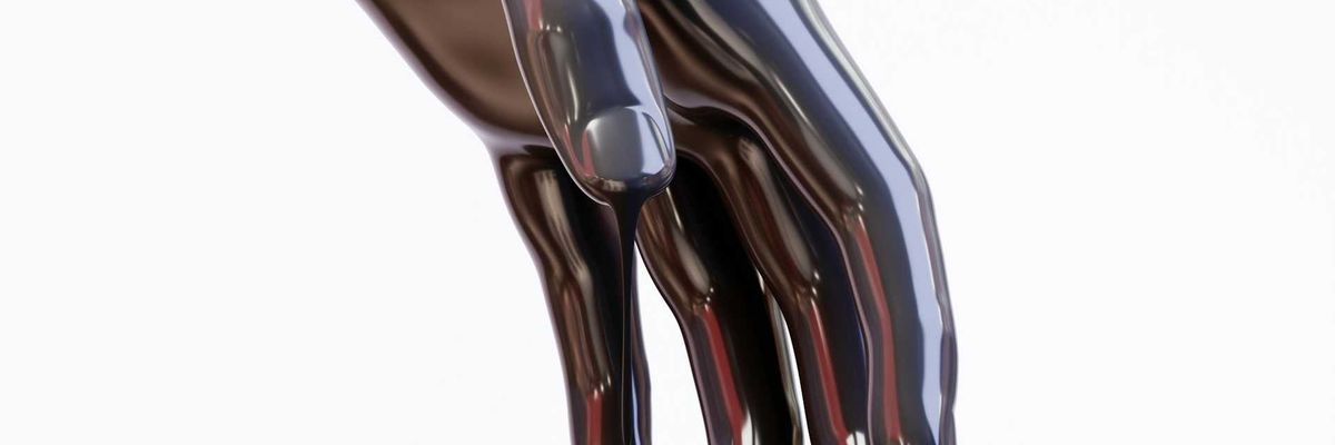 Hand covered in and dripping oil