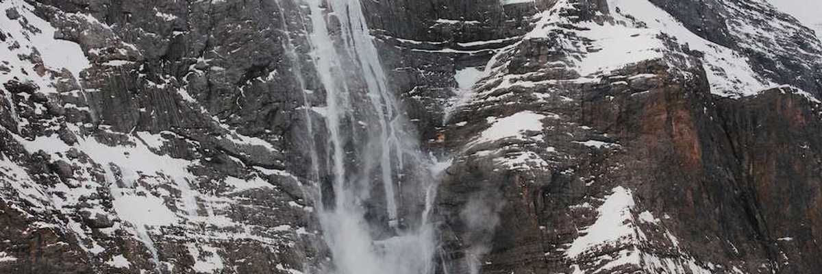 Hanging glacier with meltwater and snow sloughing from the tongue