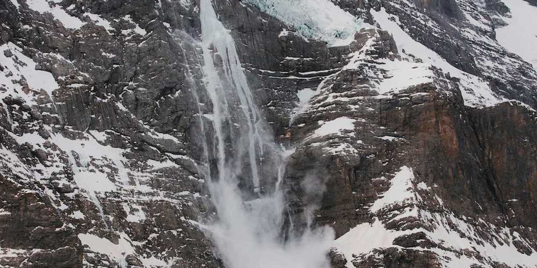Hanging glacier with meltwater and snow sloughing from the tongue