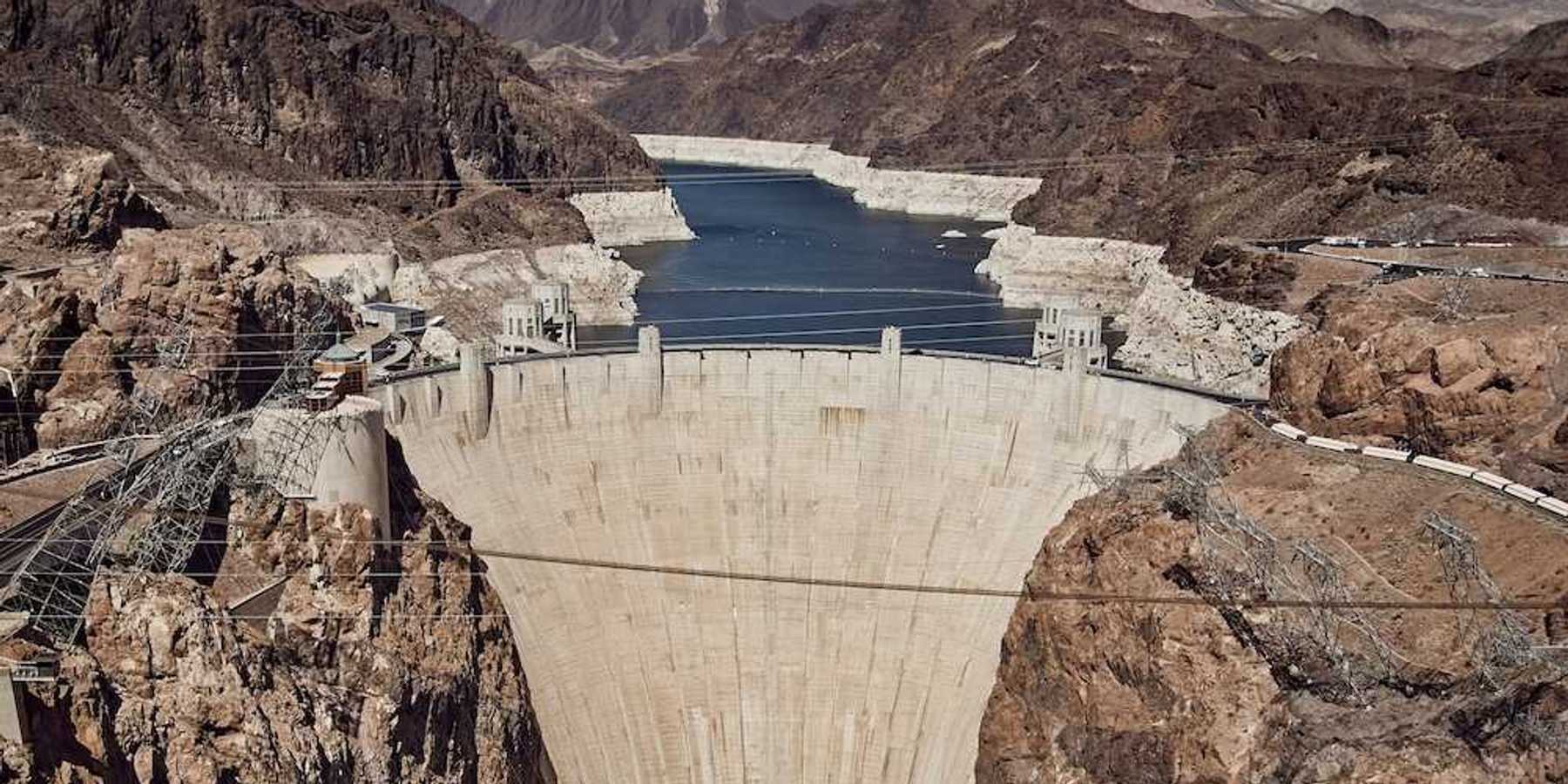 Hover Dam with Lake Mead and the Colorado River behind showing the "bathtub ring."