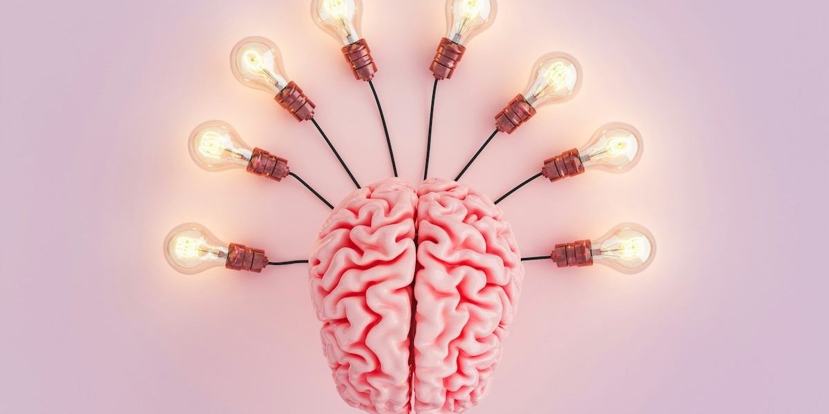 Human brain depicted connected to eight lightbulbs.