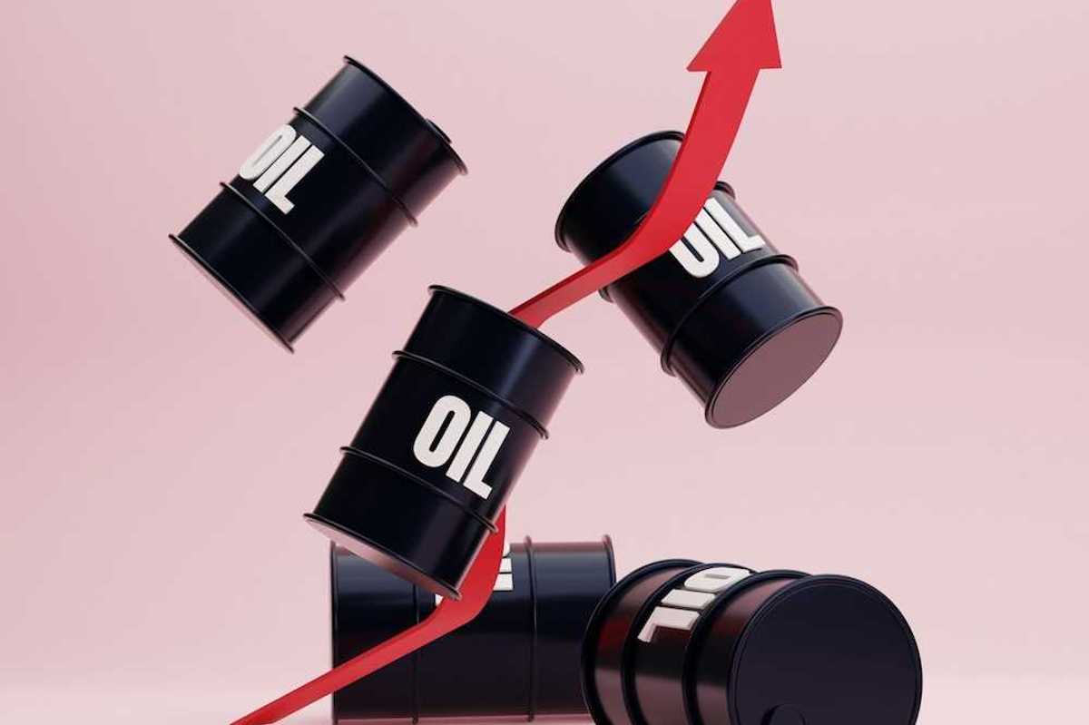 Illustration of black barrels labeled "OIL" suspended on a pink background with an intertwined red line pointing upward indicating ever-rising oil costs.